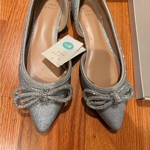 A New Day Glittering Silver Flats with Bow